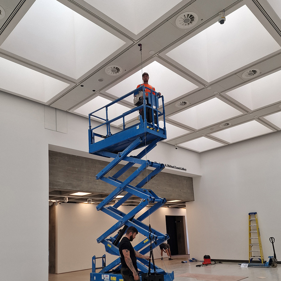 Structural survey and rigging installation at a gallery exhibition.