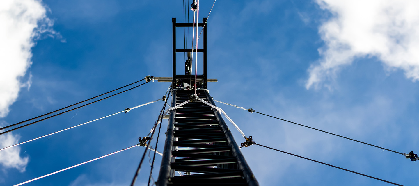 Looking up at a truss tower