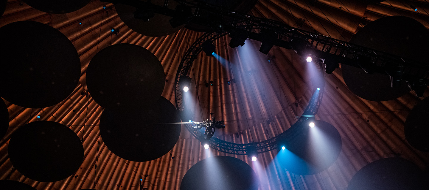 A truss circle with lighting and a wire camera at the royal albert hall.